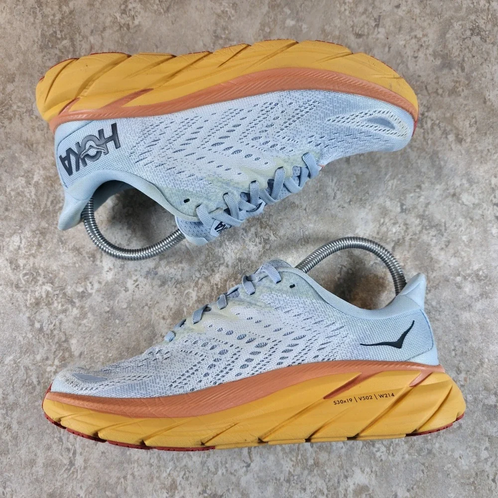 Hoka One One Women's Light Blue Running Shoes with Yellow and Orange Midsole